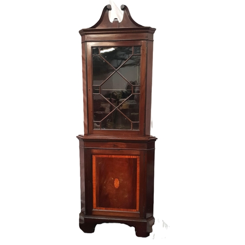 582 - MAHOGANY REGENCY STYLE CORNER CABINET
with scroll work cornice and glazed fret work front, with cros... 