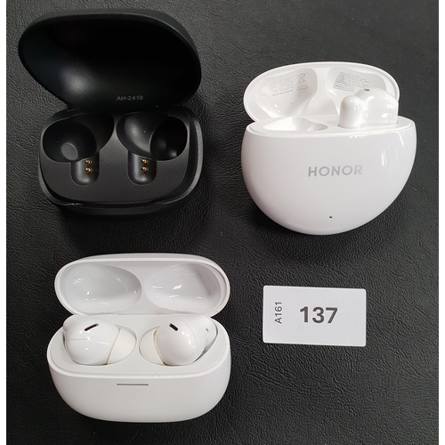 137 - PAIR OF REDMI EARBUDS IN CHARGING CASE
together with a single Honor earbud in charging case and a Sk... 