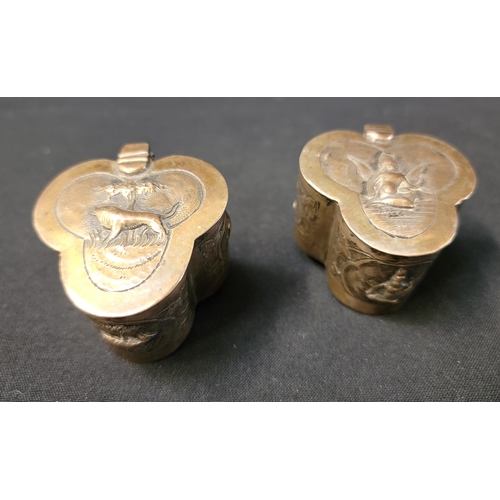 186 - PAIR OF WHITE METAL INDIAN TRINKET POTS
of trefoil form, one with depictions of deities, the other w... 