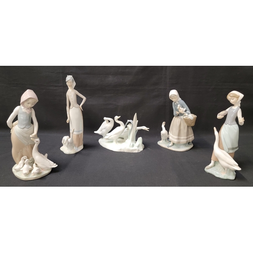 263 - FIVE LLADRO WOMEN AND GEESE FIGURINES
consisting of a woman standing over two geese; a girl holding ... 