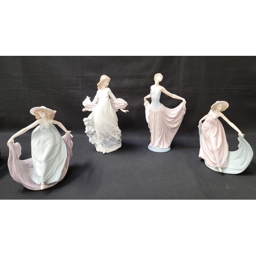 264 - FOUR LLADRO DANCING WOMEN FIGURINES
each depicting women dancing with flowing fabrics of contrasting... 