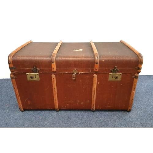 376 - LARGE TRAVEL TRUNK
in brown with banding, the interior with stripped paper, 92 x 40 x 57cm