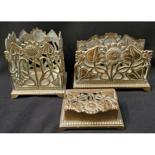 370 - ART NOUVEAU STYLE BRASS DESK SET
comprising a stamp box, a letter rack and a pen holder, all with pi... 