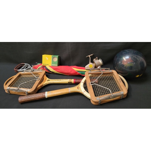 390 - SELECTION OF VINTAGE SPORTING EQUIPMENT 
comprising a pair of wooden tennis rackets, one by Slazenge... 