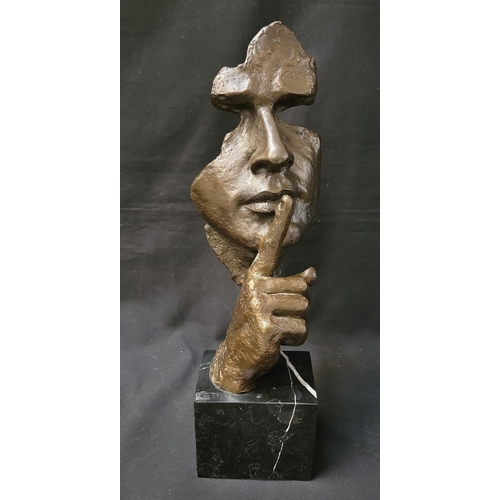 387 - STYLISED CONTEMPORARY BRONZE SCULPTURE
'Shushing' mask on marble plinth, unsigned, 47cm high