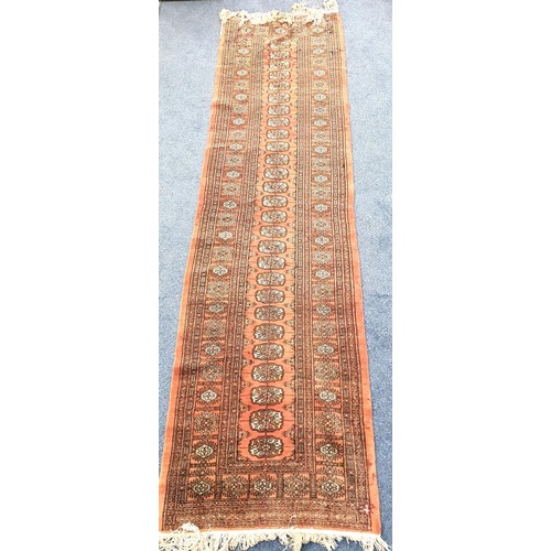 651 - VINTAGE BOHARA WOOLLEN RUNNER
with medallions on faded red ground, with fringing, 82 x 296cm; and a ... 