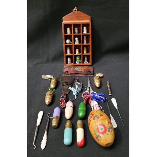 358 - SELECTION OF SEWING ACCOUTREMENTS
comprising various thimbles in wooden display case, including thre... 