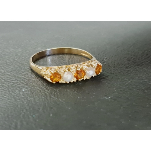 68 - CITRINE AND SEED PEARL RING
the three round cut citrines separated by seed pearls, on nine carat gol... 