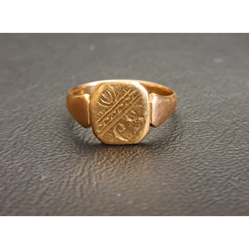 124 - NINE CARAT GOLD SIGNET RING
the panel with engraved decoration, ring size R and approximately 3.3 gr... 