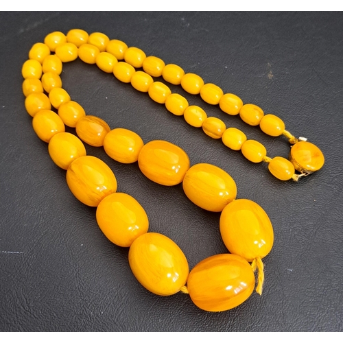 148 - GRADUATED BUTTERSCOTH AMBER BEAD NECKLACE
the largest bead approximately 26mm, the necklace 69cm lon... 