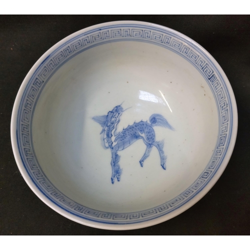 250 - BLUE AND WHITE CHINESE FOOTED BOWL
with geometric pattern around the edge, dragon in the centre of t... 