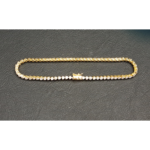 27 - DIAMOND LINE BRACELET
in eighteen carat gold, the diamonds totalling 2.35cts, 18.5cm long and approx... 