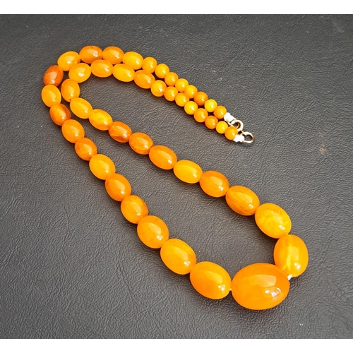 71 - GRADUATED BUTTERSCOTCH AMBER BEAD NECKLACE
the largest bead approximately 21mm long, the necklace ap... 