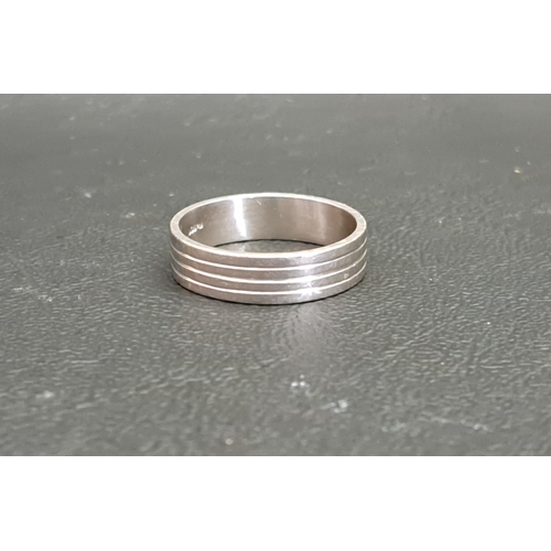 77 - PLATINUM WEDDING RING
with banded decoration, ring size O-P and approximately 5.7 grams