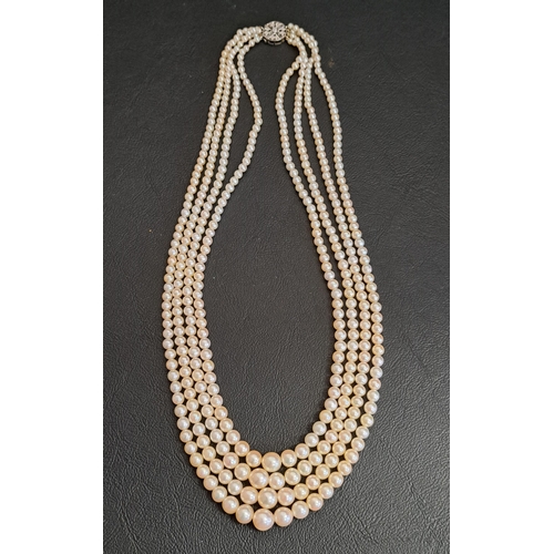 114 - IMPRESSIVE FOUR STRAND PEARL NECKLACE
with diamond set unmarked gold clasp, the longest strand appro... 