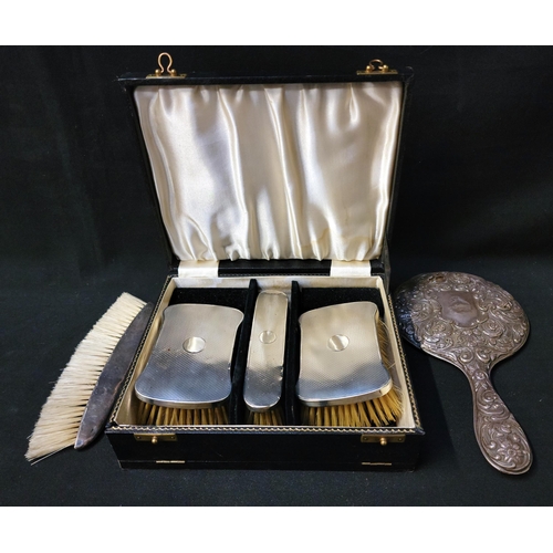 215 - GENTLEMAN'S CASED SILVER BRUSH SET 
the three brushes all with engine turned decoration to the backs... 