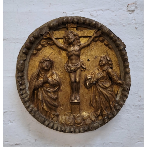 343 - 18th CENTURY CARVED OAK GESSO AND GILT PLAQUE DEPICTING THE CRUCIFIXION 
within a carved ball moulde... 