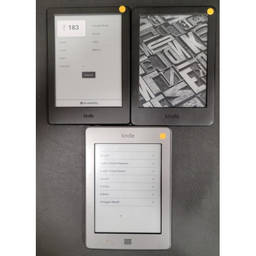 THREE AMAZON KINDLE E-READERS comprising a Basic 3, serial number G090 ...