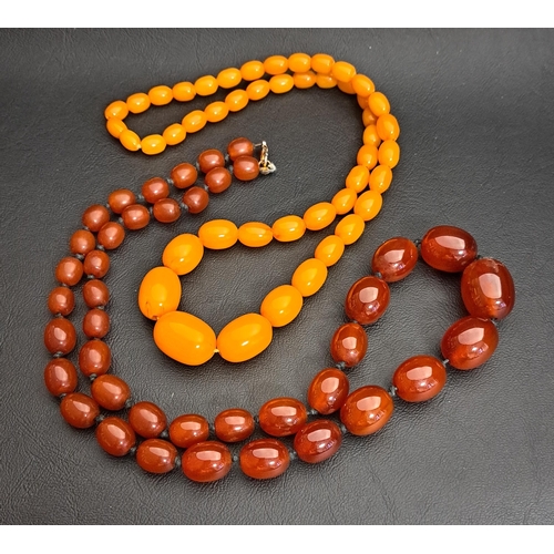 104 - TWO GRADUATED AMBER COLOURED BEAD NECKLACES
one butterscotch coloured, approximately 60cm long and 4... 