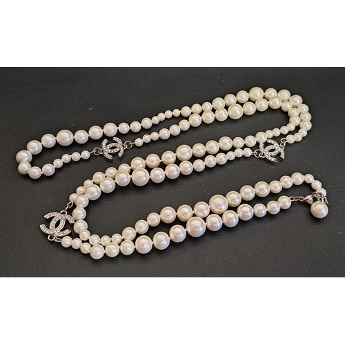 123 - CHANEL FAUX PEARL AND CRYSTAL NECLACE
the graduated faux pearl sections interspersed with the three ...