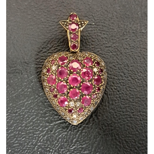 42 - VICTORIAN STYLE RUBY AND DIAMOND HEART SHAPED LOCKET PENDANT
the multiple rubies ranging in size fro... 
