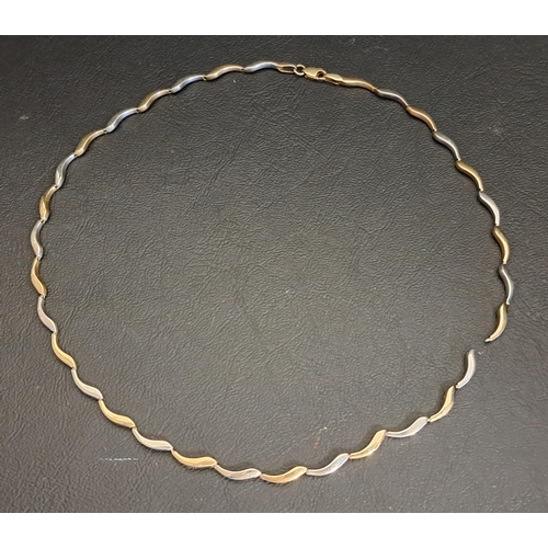 41 - NINE CARAT TWO TONE GOLD NECKLACE
with alternating white and yellow gold links, approximately 9.6 gr... 