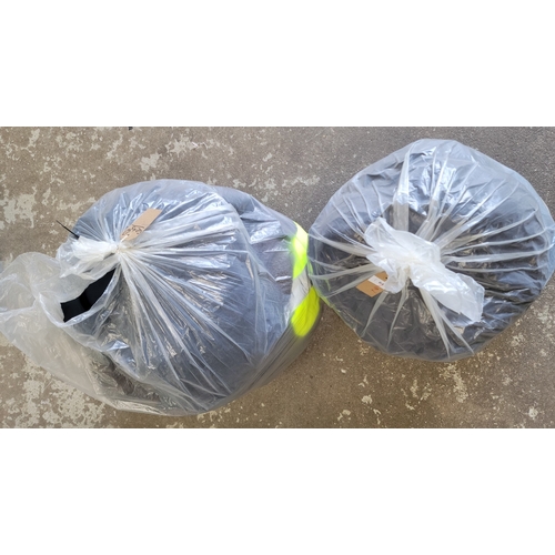 64 - TWO BAGS OF GENTS CLOTHING ITEMS
including: Nike, River Island, Berghaus, Timberland and Next