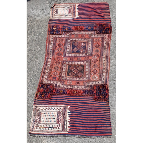 409 - VINTAGE PERSIAN SADDLE COVER BLANKET
with red and blue ground, and carpet sections, 205 x 92cm