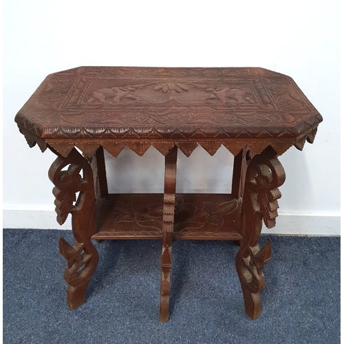 19th CENTURY BURMESE CARVED ELEPHANT TABLE
the top with carved elephants on heavily carved legs with shelf, 68 x 65 x 40cm