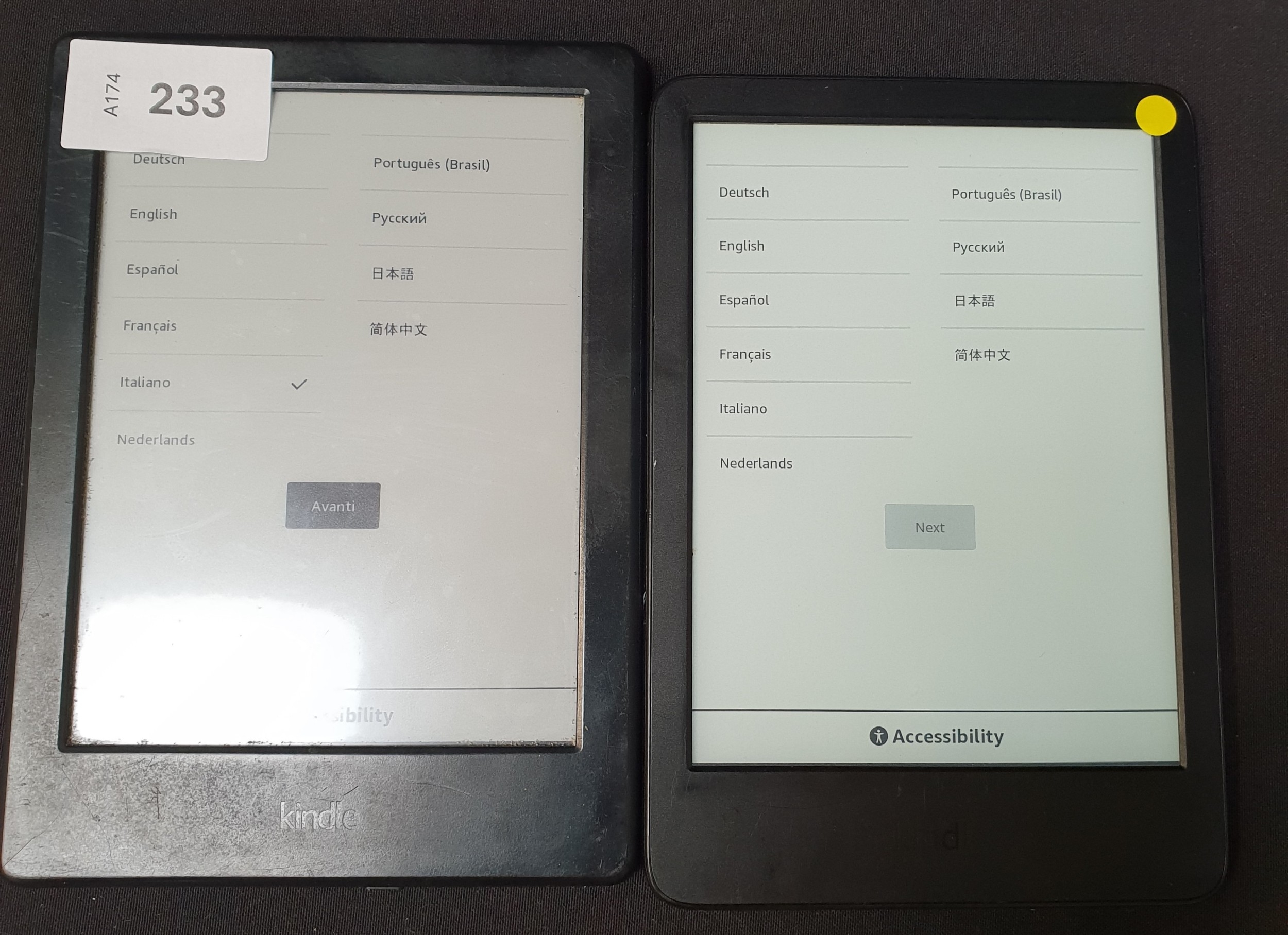 TWO AMAZON KINDLE E-READERS comprising a Basic 4, serial number G092 ...