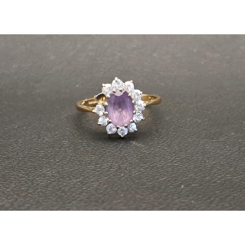 PURPLE AND CLEAR CZ SET CLUSTER RING
on nine carat gold shank, ring size P and approximately 2.1 grams (one small clear gemstone missing)