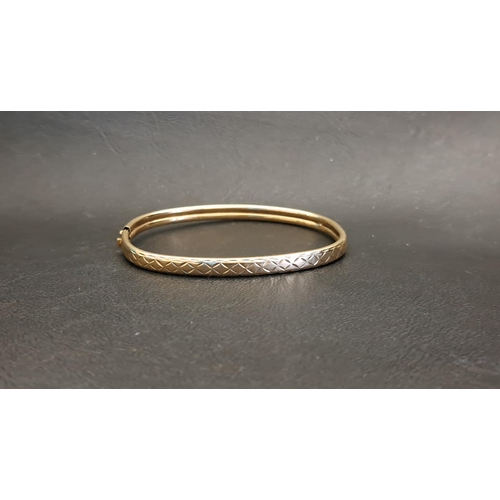 37 - NINE CARAT GOLD BANGLE
with engraved decoration, approximately 5.1 grams (clasp damaged)