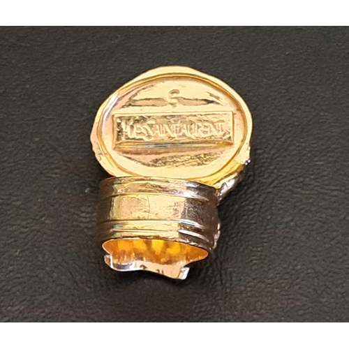 39 - YVES SAINT LAURENT ARTY RING
the blue/gold cabochon stone in gilt metal textured setting, size 5