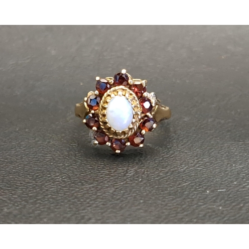 47 - OPAL AND GARNET CLUSTER RING
the central oval cabochon opal measuring approximately 5 x 3.5mm, in te... 
