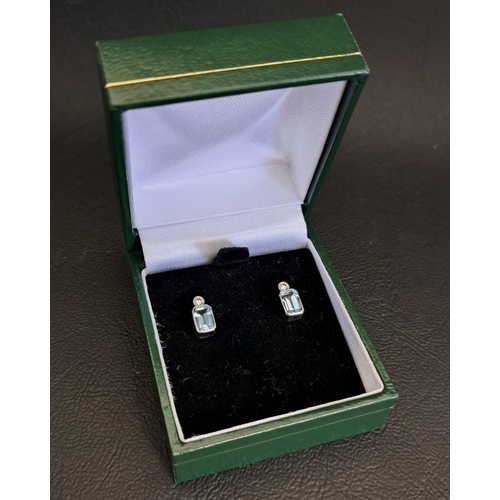 16 - PAIR OF AQUAMARINE AND DIAMOND STUD EARRINGS
the rectangular cut aquamarine on each approximately 0.... 