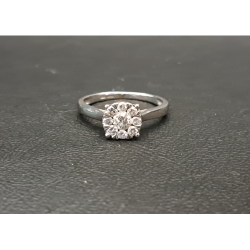 26 - DIAMOND CLUSTER RING
the central larger diamond approximately 0.25cts in eight diamond surround, in ... 