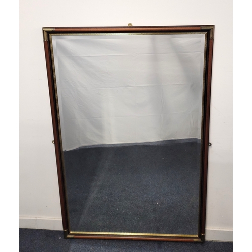 596 - LARGE STAINED WOOD FRAMED MIRROR
with metal corner detail and bevel edged mirror, 149 x 98cm