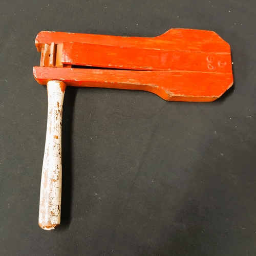 VINTAGE FOOTBALL RATTLE painted in red and white, 28cm long