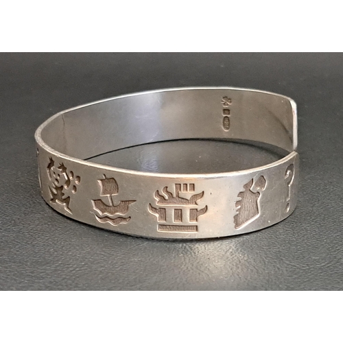 43 - MICHAEL HILLIAR IRISH SILVER 'HISTORY OF IRELAND' CUFF BANGLE
the 13 engraved symbols representing i... 