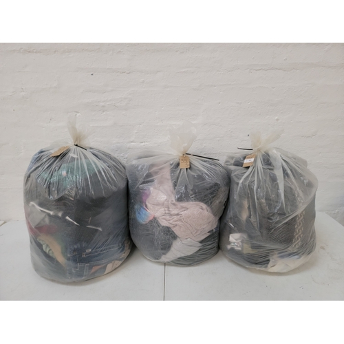 35 - THREE  BAGS OF GENTS CLOTHING ITEMS
including: Tommy Hilfiger, Dickies and Adidas