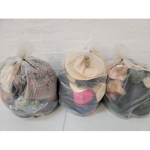 44 - THREE  BAGS OF HATS, SCARVES AND GLOVES