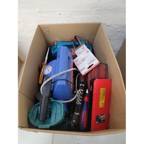 7 - ONE BOX OF TOOLS
including: car jumpstarter kit, shears, a Makita drill, screwdrivers, batteries, et... 
