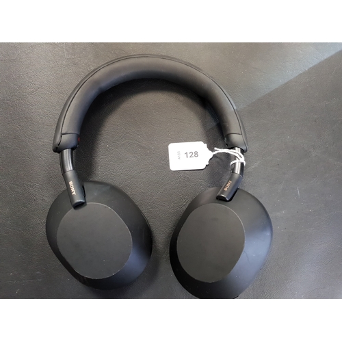 128 - PAIR OF SONY WH-1000XM5 HEADPHONES 
model YY2954
Note: some wear to ear rests and damage to leg