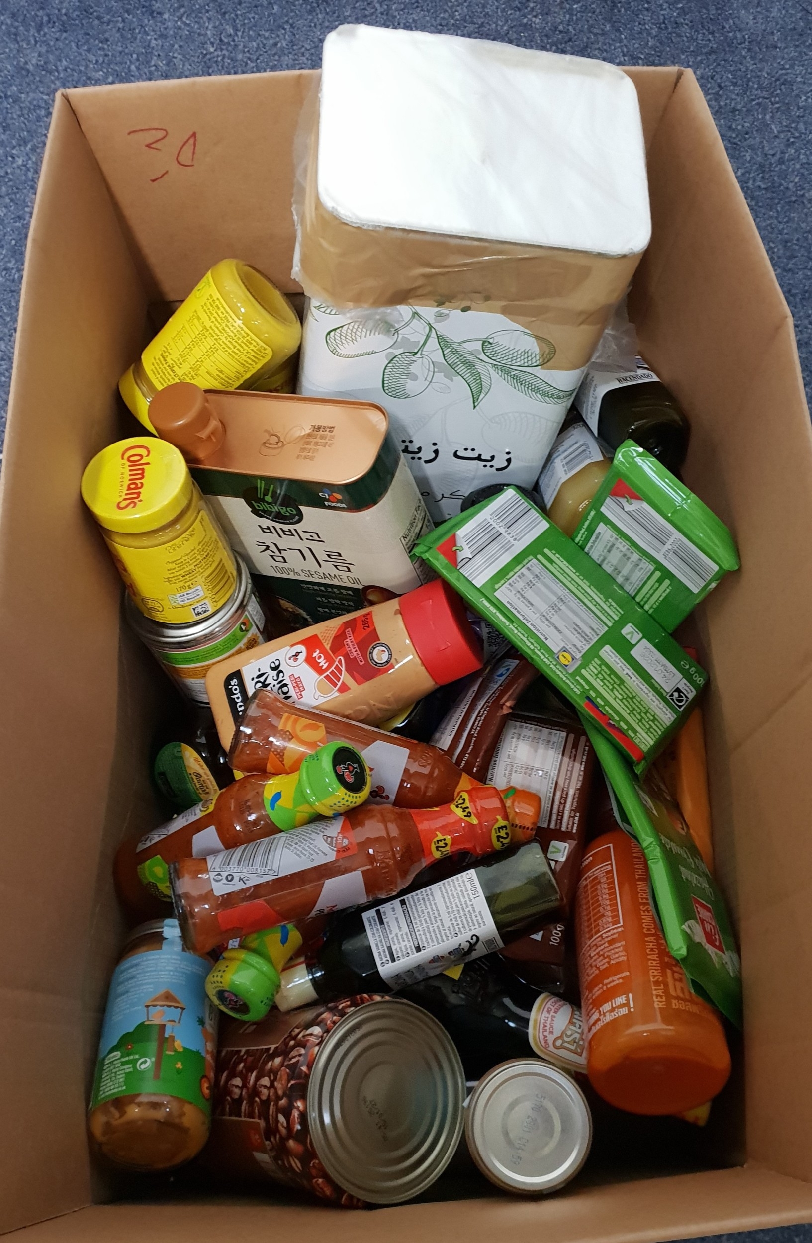 ONE BOX OF CONSUMABLE ITEMS including: Sesame oil, Nando's hot sauces ...