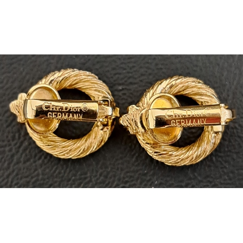 26 - VINTAGE CHRISTIAN DIOR GILT JEWELLERY
comprising a pair of earrings of twisted ring design, with cli... 