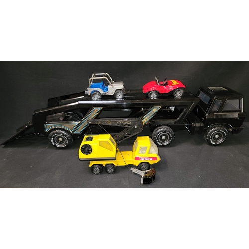 452 - VINTAGE BLACK TONKA CAR TRANSPORTER
with blue and gilt trim, 102cm long, with silver and blue Tonka ... 