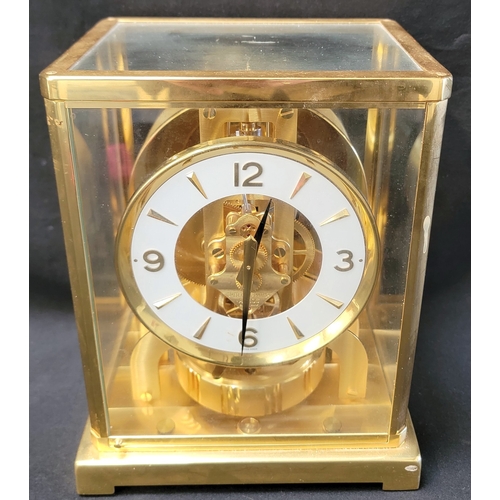 322 - JAEGER-LECOULTRE BRASS CASED ATMOS CLOCK 
with a circular white enamel dial, bearing raised Arabic a...
