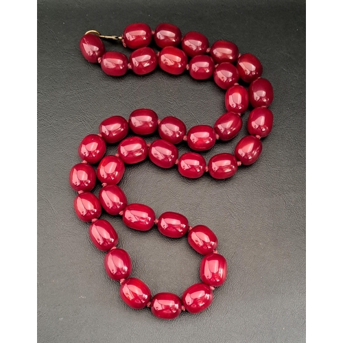 AMBER COLOURED BEAD NECKLACE
the beads approximately 1.8-2cm long, the necklace approximately 90cm long and approximately 187 grams