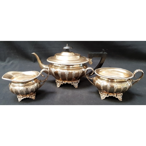 140 - IMPRESSIVE GEORGE V SILVER TEA SET
comprising tea pot, sugar bowl and milk jug, all with relief scro... 