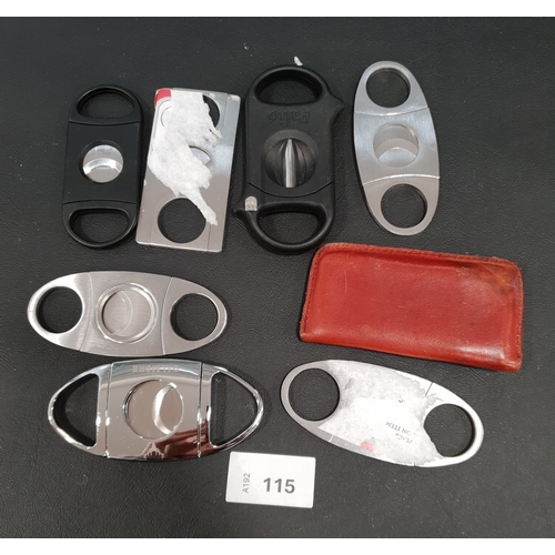 115 - EIGHT CIGAR CUTTERS 
Note: You must be over the age of 18 to bid on this lot.